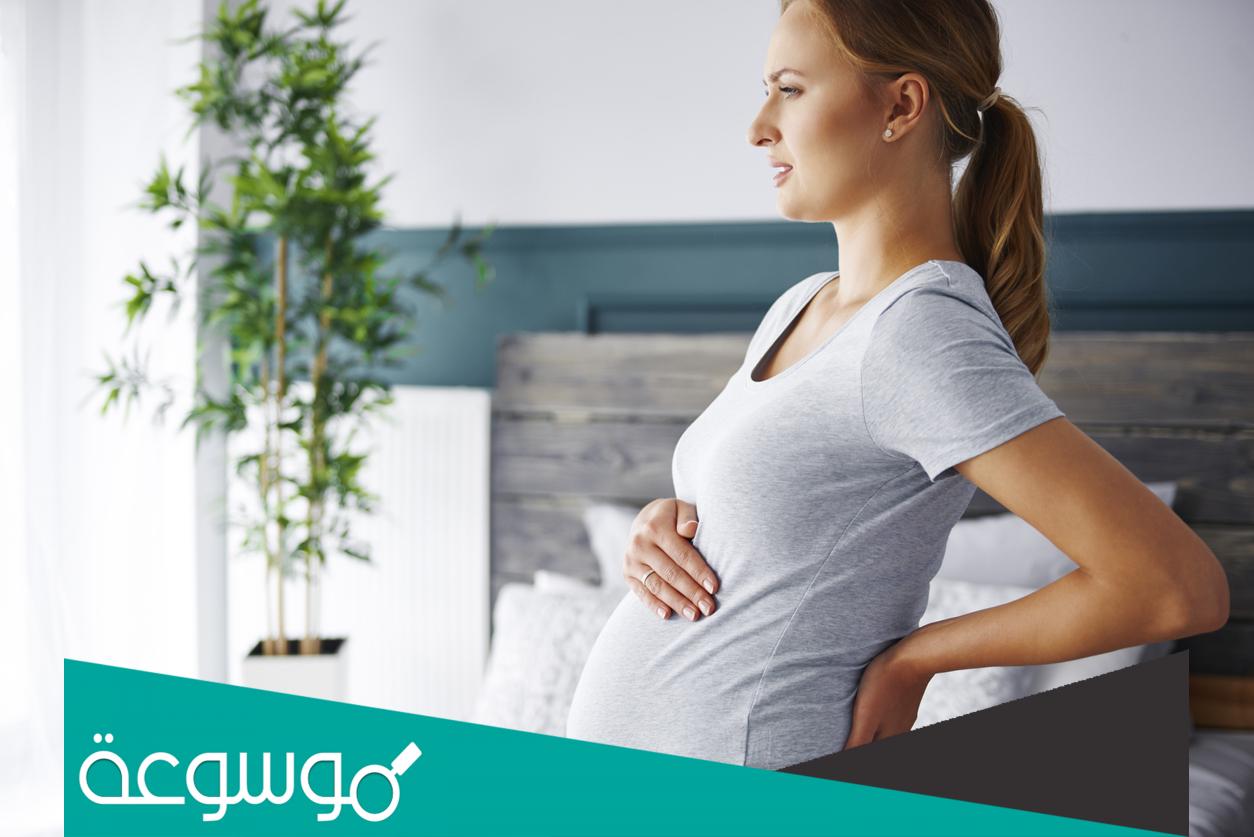 هل وجع الظهر والجوانب من علامات الحمل